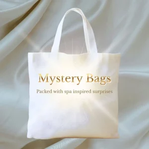 “The Country Spa Mystery Bags – luxury spa mystery gift bag with gold text on a soft neutral background.”