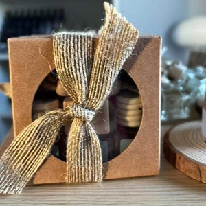 Candles from the Croft car diffuser trio gift set in kraft box with natural bow and festive backdrop