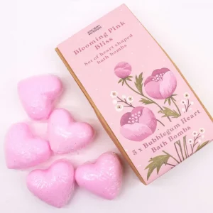 Set of five pink heart-shaped bath bombs with packaging