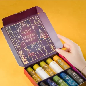 ARRAN Deluxe Discovery Set open box showing 10 miniature bottles on yellow background