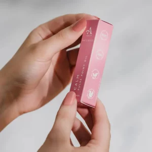 Pink Calm Pulse Point Oil box held in hands