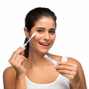 Close-up of Rapidex ampoules and cotton applicator – gentle exfoliating skincare treatment.
