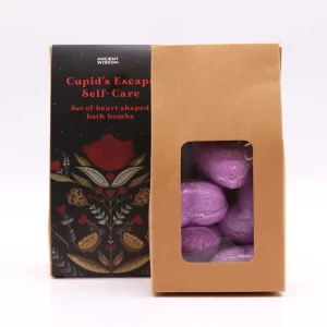 Set of purple heart-shaped bath bombs with packaging