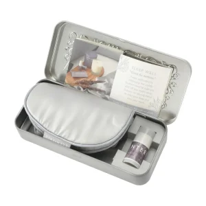 Scentered Goodnight Sleep Set in an open silver tin with grey sleep eye mask, Sleep Well aromatherapy balm and ritual guide