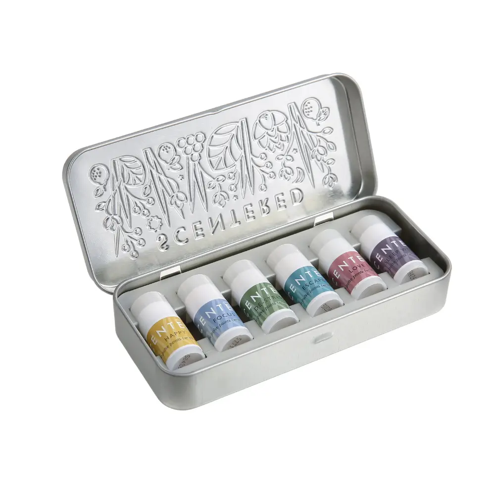 Scentered Discovery Set showing six mini aromatherapy balms in an open reusable silver presentation tin.