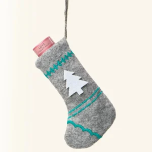 Scentered Love aromatherapy balm in a hanging grey felt Christmas stocking with turquoise stitching and a white Christmas tree