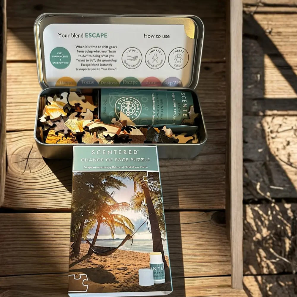 Scentered Escape mindfulness puzzle tin with wooden pieces, aromatherapy balm and tropical beach packaging