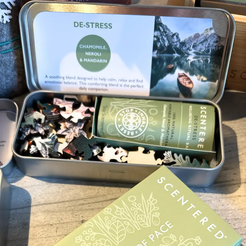 Open Scentered De-Stress puzzle tin with wooden pieces, calming aromatherapy balm and green presentation sleeve